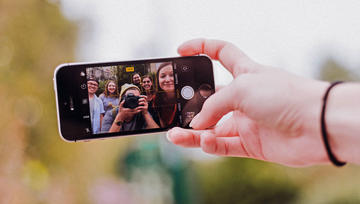 Group of students taking selfie with phone