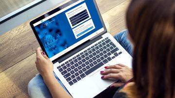 Person logging into CareerConnect on a laptop