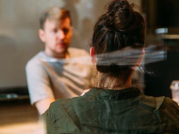 Two people talking in confidence