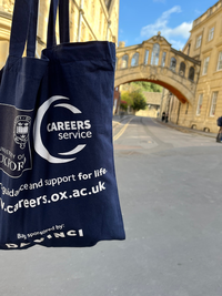 Blue Careers Service tote bag in front of Hertford Bridge 